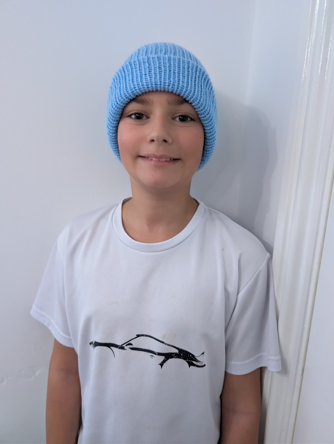 Jamie wearing a light blue handmade beanie